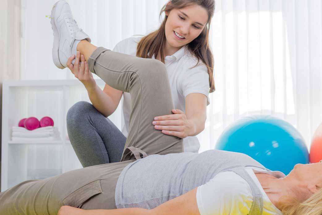 physical therapist working with a patient