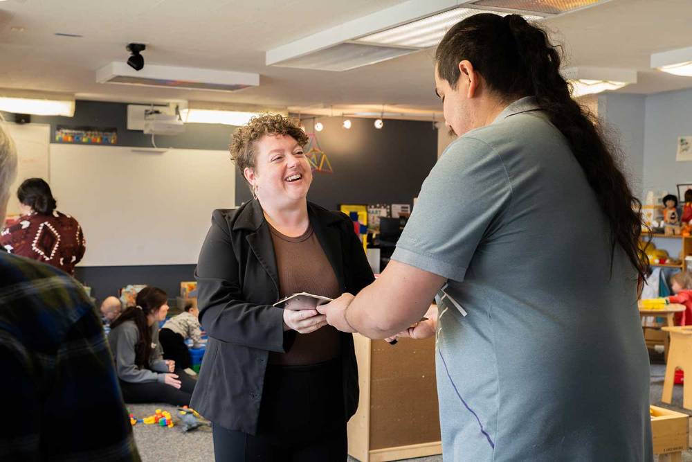 Two adults talking, smiling