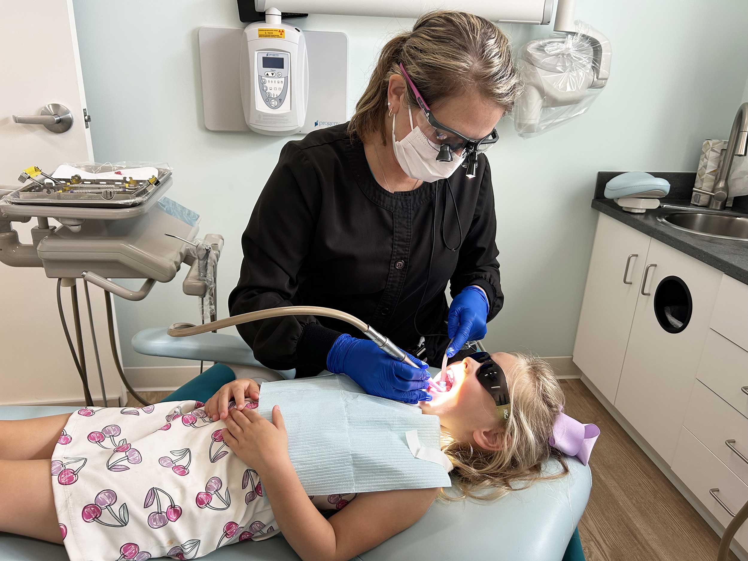 Dental hygienist working on patient