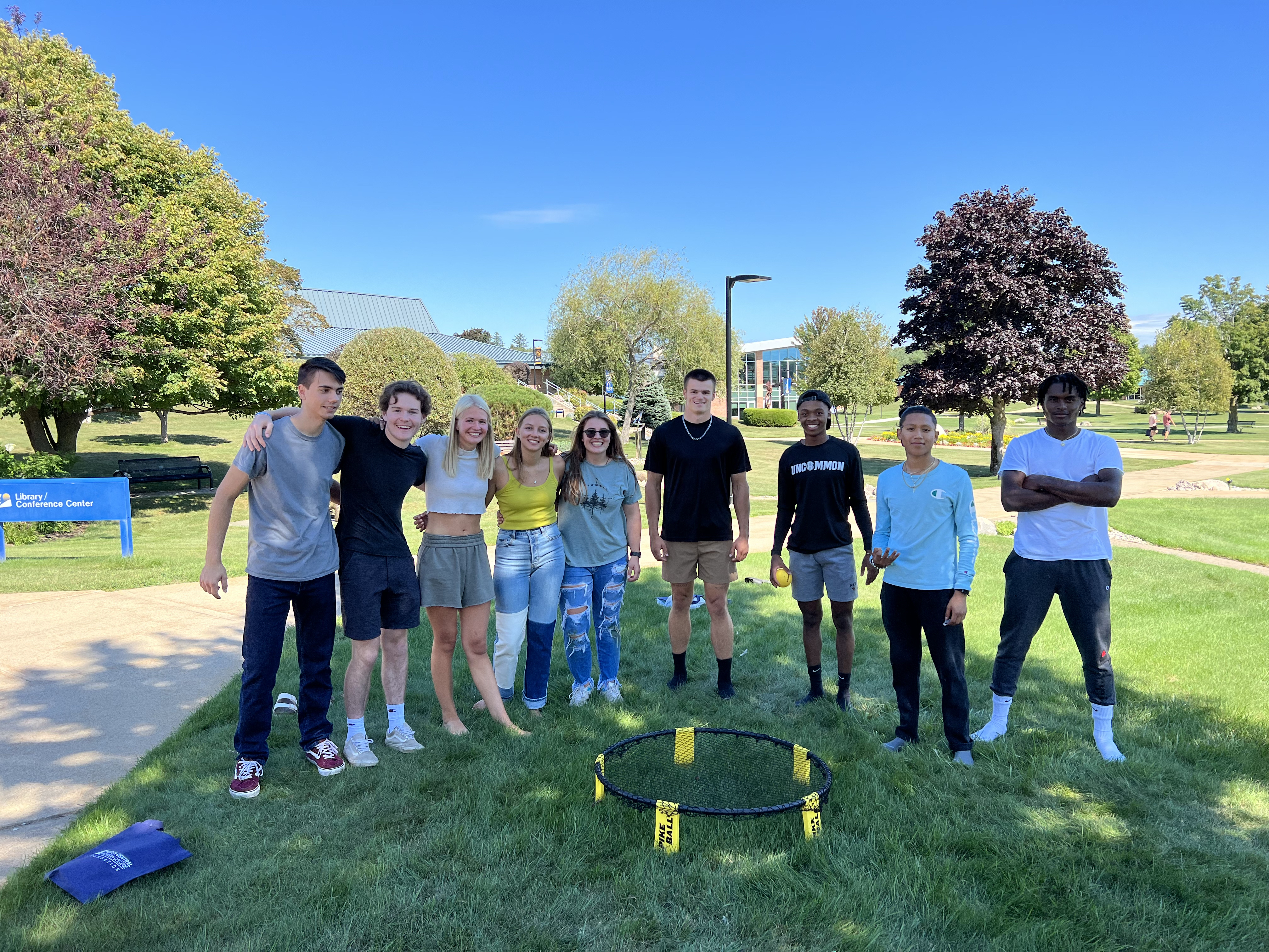 Students, standing outside smiling