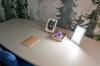Photo of table with a journal, light therapy lamp, and puzzle